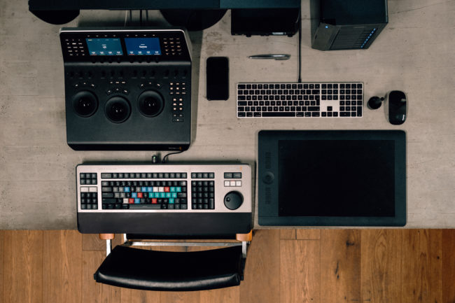 Video editor working on color correction and editing film footage in post-production