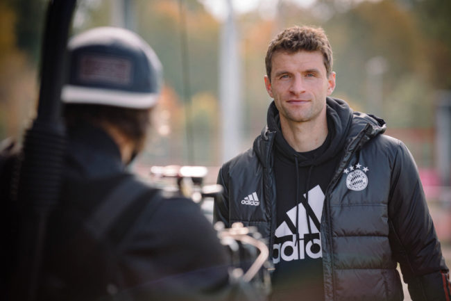 Adidas jersey handoff to grassroots player with Thomas Müller